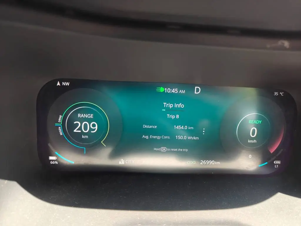 Trip B on the Nexon EV 45 instrument cluster at journey end. 1,454 km covered, 150 Wh/km average energy consumption, odometer at 26,990 km