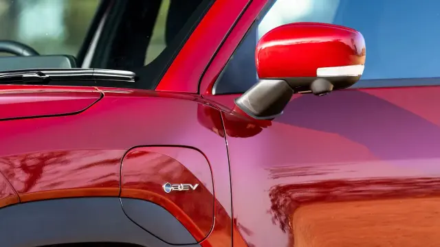 Toyota Urban Cruiser Ebella exterior - Charging Port Lid with BEV Branding - image