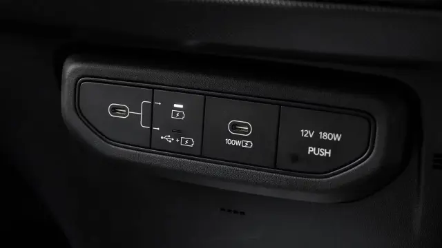Kia Syros EV interior - Front USB and Mobile Charging Port - image