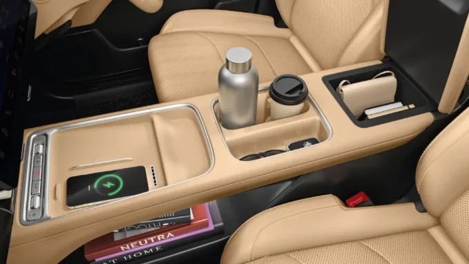 The MG Hector Tomahawk EV’s centre console features storage spaces and a wireless charging pad.